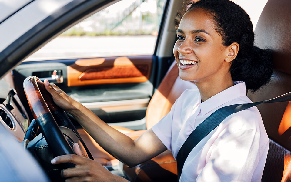 Auto-Loans-960x600 – Chemung Canal Trust Company  A woman is seated in the driver's seat of a car