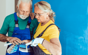 Mortgage-712x446 – Chemung Canal Trust Company  A man and woman look at color swatches to pick a paint color