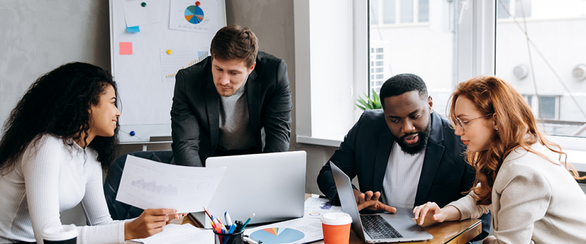 Business-Banking-960×600 A group of people in a conference room on their computers