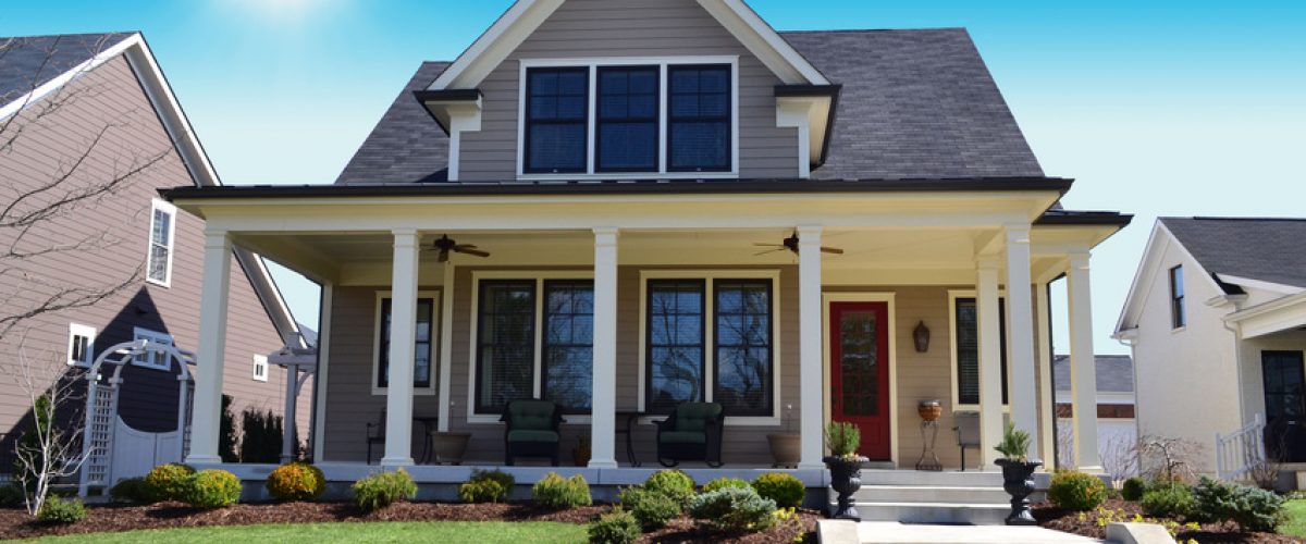 Photo of a house on a sunny street