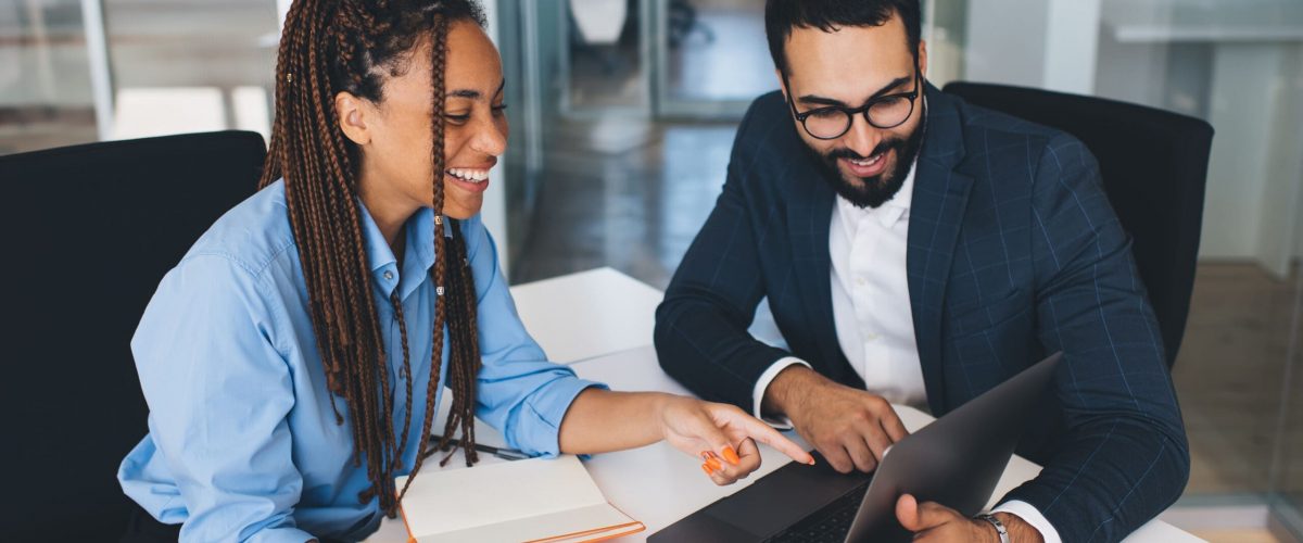 People looking at a computer screen together